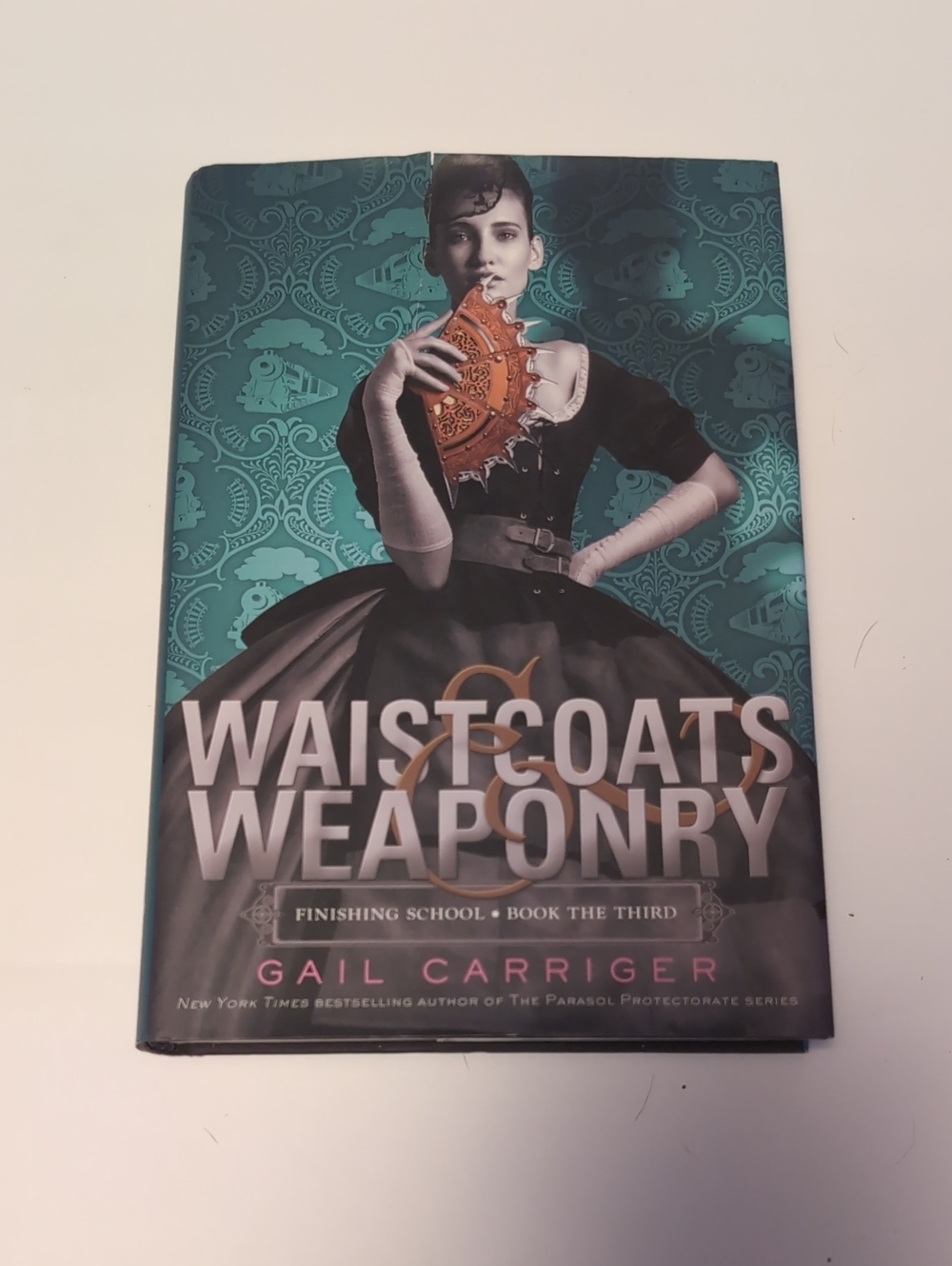 Waistcoats & Weaponry by Gail Carriger - Teal & Black Cover